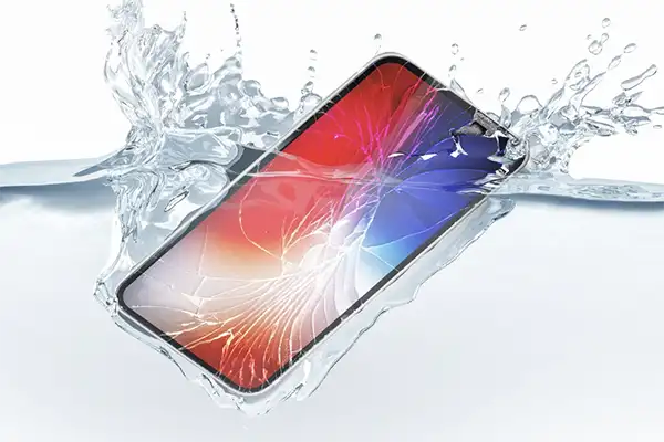 Technician diagnosing water damage in a smartphone at Sun City Cell Phone Repair.